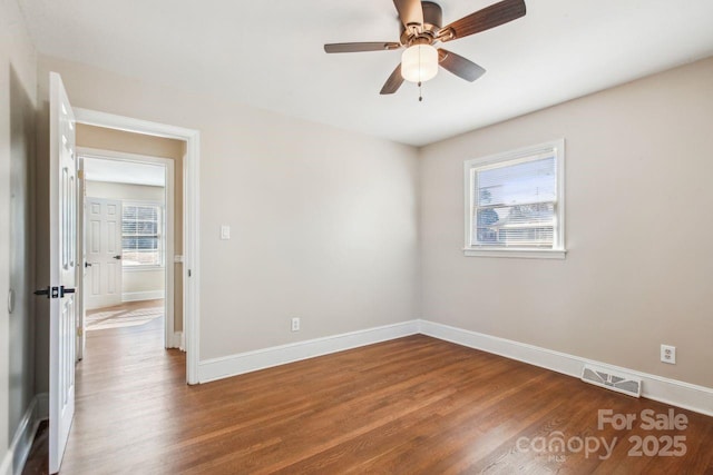 empty room featuring ceiling fan and wood-type flooring