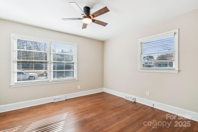 spare room with ceiling fan and hardwood / wood-style floors