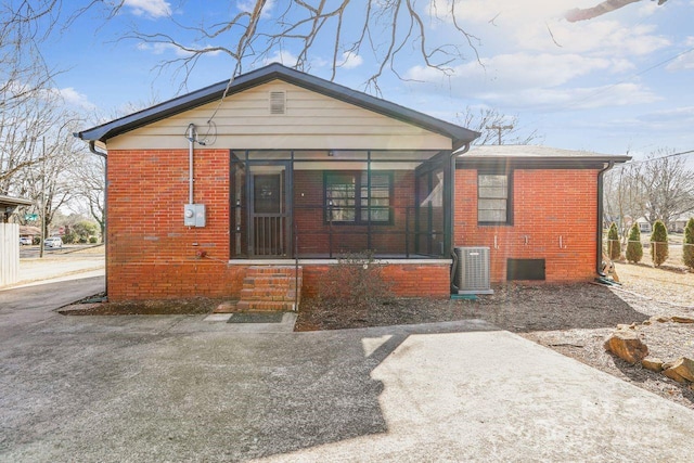 back of house with cooling unit and covered porch