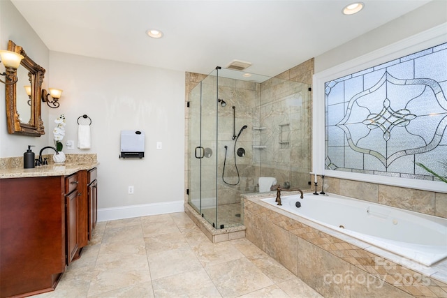 bathroom featuring vanity and separate shower and tub