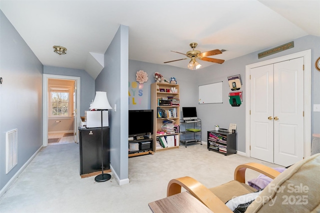 living room featuring carpet flooring and ceiling fan