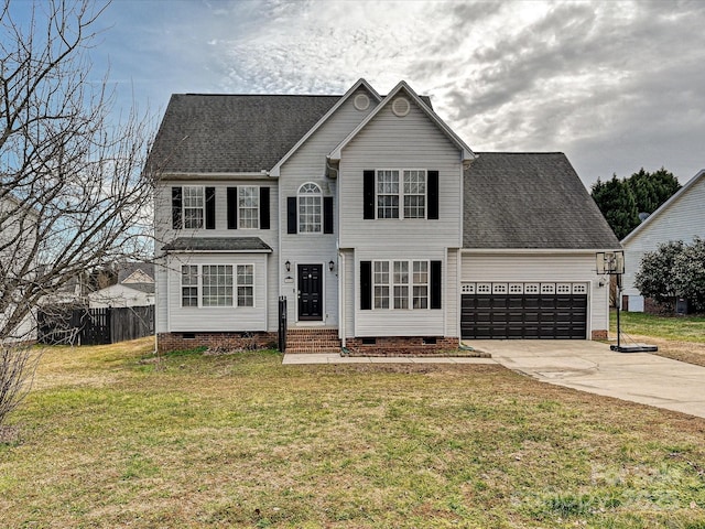 view of front of house featuring a garage and a front lawn