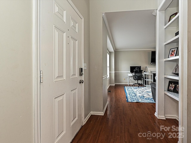 hall with dark hardwood / wood-style flooring and crown molding