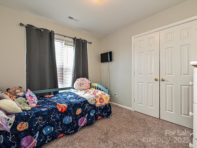 carpeted bedroom featuring a closet