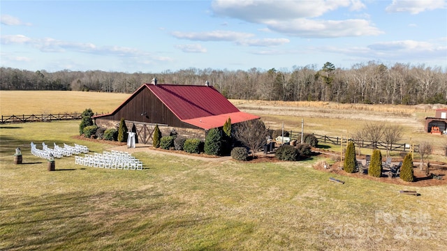 view of yard with a rural view