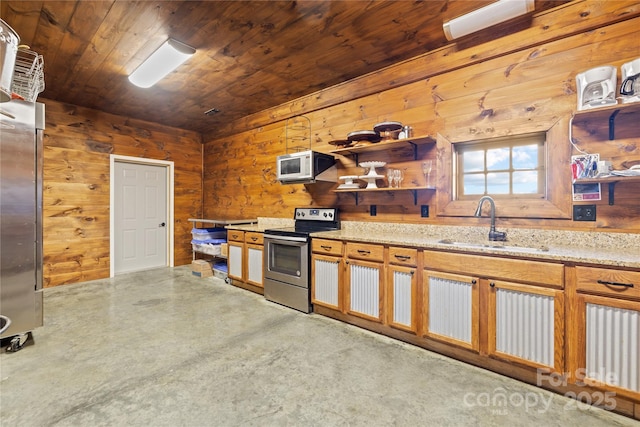 kitchen with stainless steel electric range oven, wooden walls, sink, wood ceiling, and light stone countertops