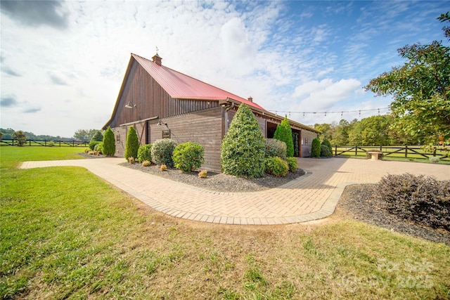 view of property exterior with a yard