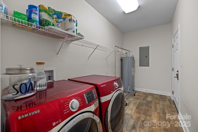 laundry room featuring washer and dryer, electric panel, hardwood / wood-style floors, and water heater