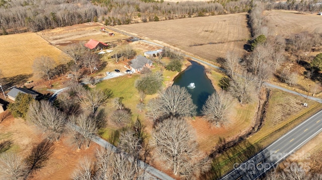 drone / aerial view featuring a water view and a rural view