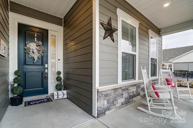 doorway to property with a porch