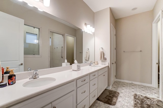 bathroom featuring tile patterned floors, vanity, and a shower