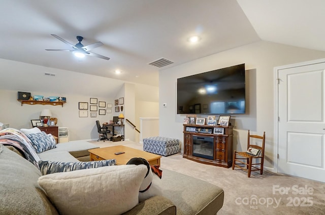 carpeted living room with vaulted ceiling and ceiling fan