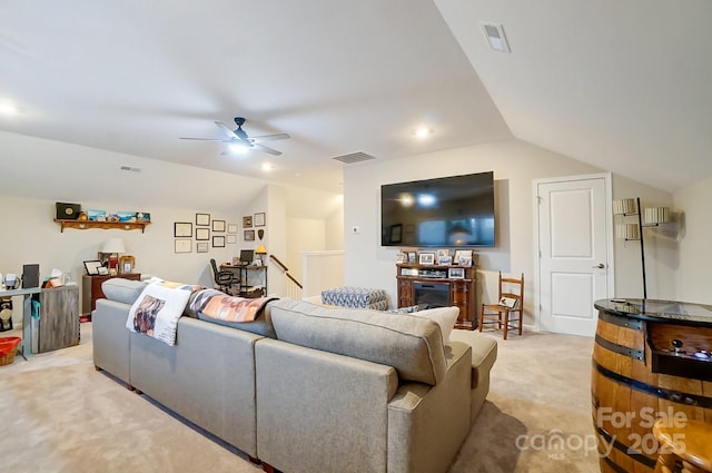 carpeted living room featuring lofted ceiling and ceiling fan