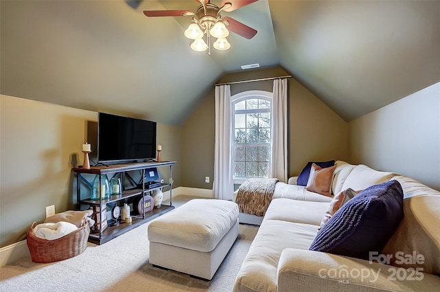 living room featuring ceiling fan, carpet floors, and vaulted ceiling