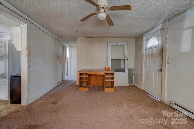 unfurnished living room with ceiling fan, a baseboard heating unit, light carpet, and a textured ceiling