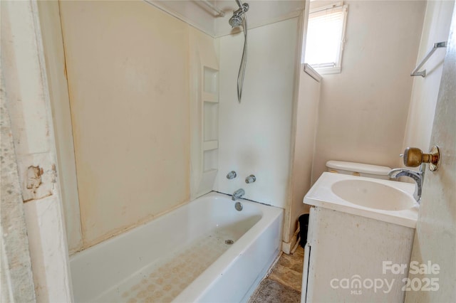 bathroom with vanity and  shower combination