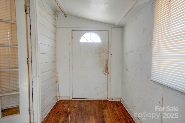 doorway to outside with vaulted ceiling and dark hardwood / wood-style floors