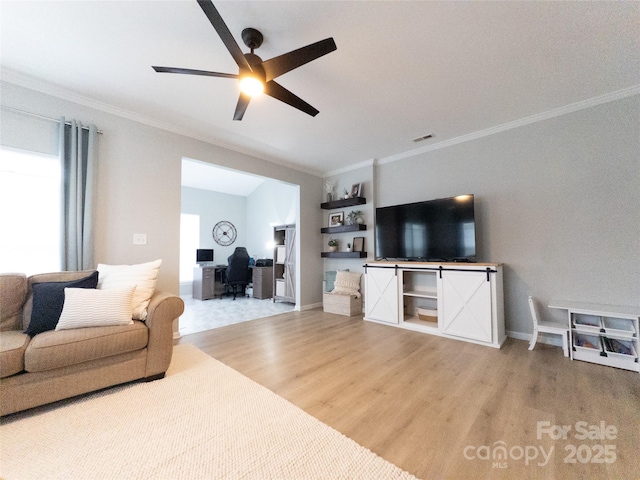 living room with ceiling fan, ornamental molding, and wood-type flooring