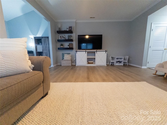 living room with hardwood / wood-style flooring and ornamental molding