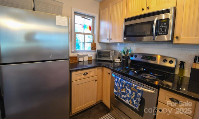 kitchen with tasteful backsplash, appliances with stainless steel finishes, and light brown cabinets