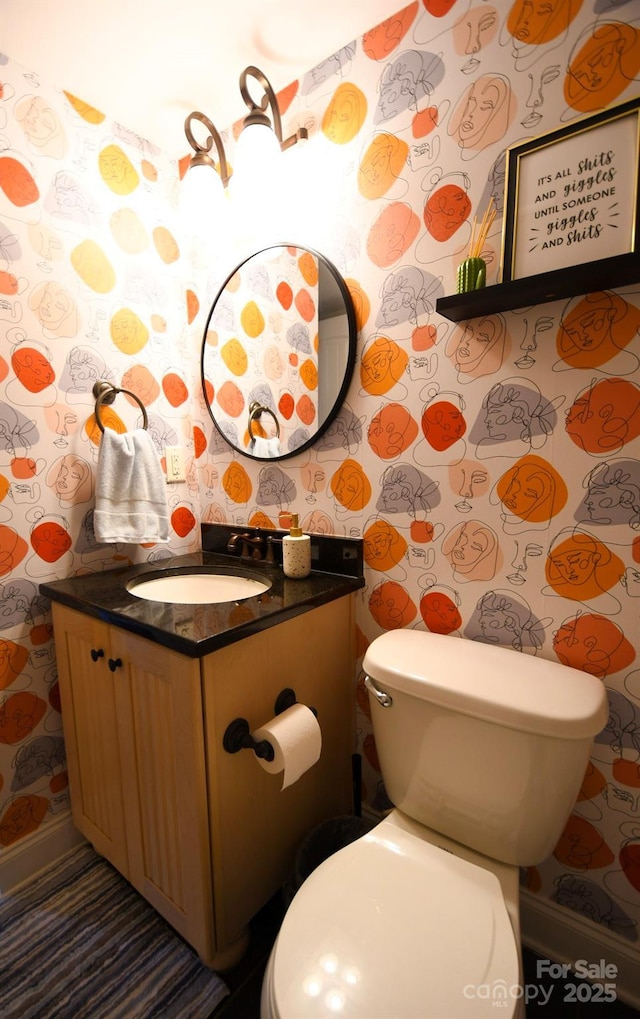 bathroom with vanity and toilet