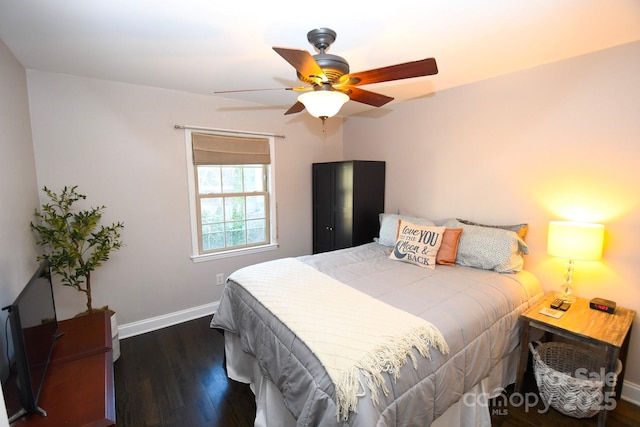 bedroom with dark wood-type flooring and ceiling fan