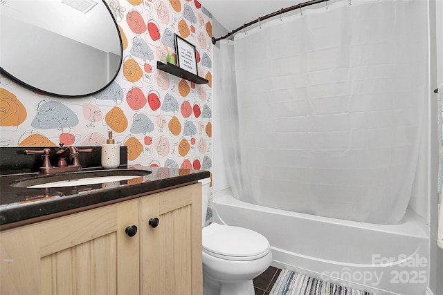 full bathroom featuring shower / tub combo with curtain, vanity, and toilet