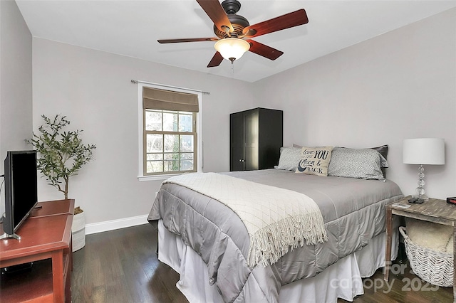 bedroom featuring ceiling fan and dark hardwood / wood-style floors