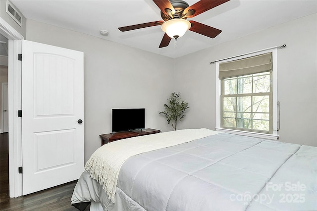 bedroom featuring dark wood-type flooring and ceiling fan