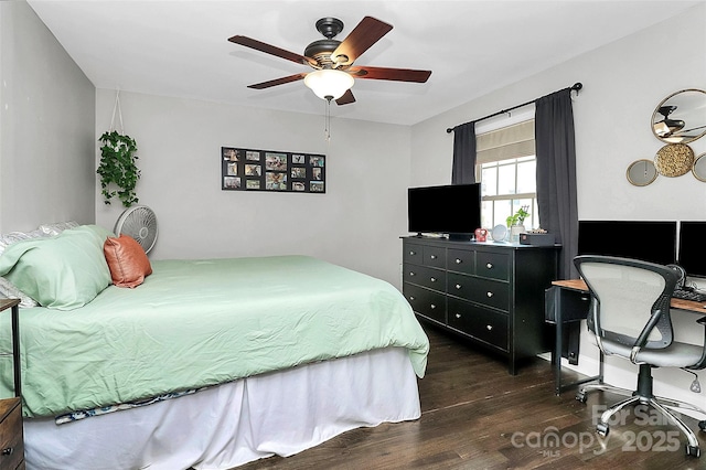 bedroom with dark hardwood / wood-style floors and ceiling fan