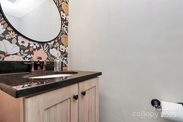 bathroom featuring vanity and tasteful backsplash