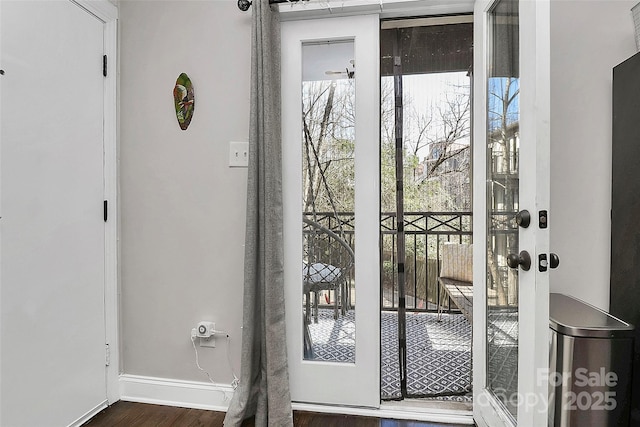 doorway to outside with dark hardwood / wood-style floors