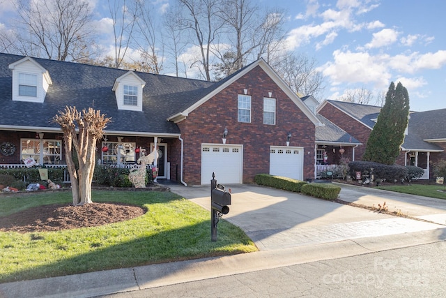 view of front of property with a garage and a front yard