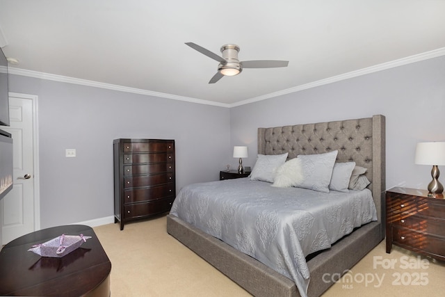 bedroom with ceiling fan, ornamental molding, and carpet floors