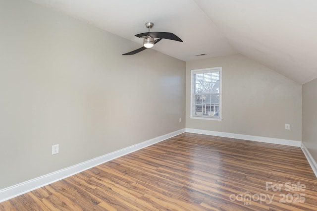 bonus room with dark wood-type flooring, ceiling fan, and vaulted ceiling