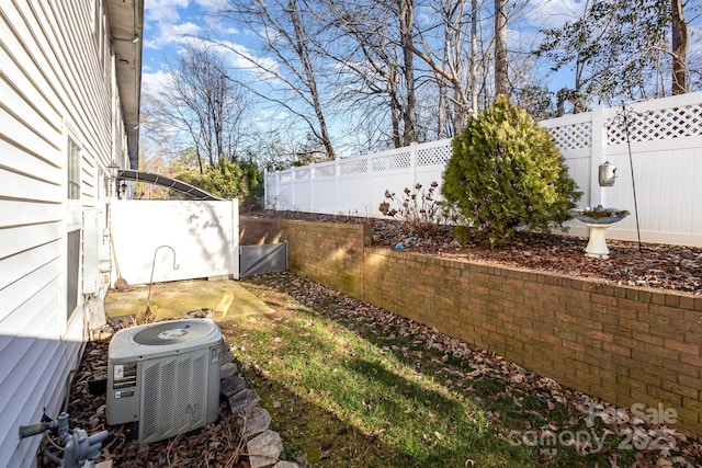 view of yard with central AC unit