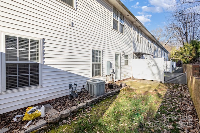 back of house with a patio area and central air condition unit