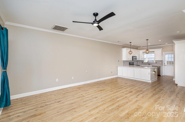 unfurnished living room featuring crown molding, ceiling fan, sink, and light hardwood / wood-style flooring