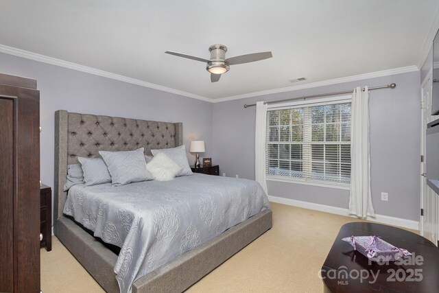 bedroom featuring ceiling fan, light colored carpet, and ornamental molding