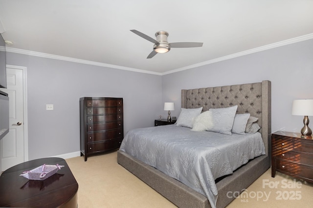 carpeted bedroom with ornamental molding and ceiling fan