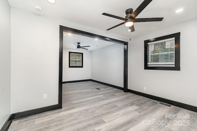 empty room with light hardwood / wood-style floors