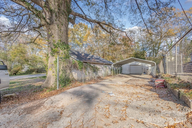 view of side of property with a carport