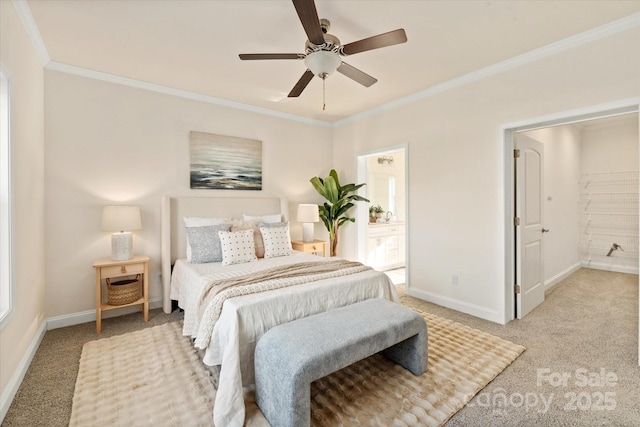 bedroom with a ceiling fan, connected bathroom, crown molding, baseboards, and light colored carpet