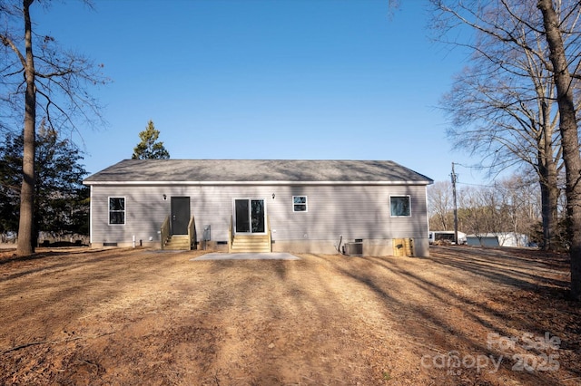 rear view of property with crawl space, cooling unit, and entry steps