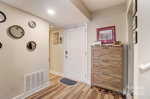 foyer with light hardwood / wood-style floors