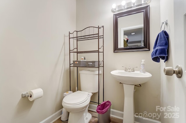 bathroom with sink and toilet