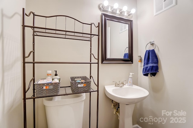 bathroom with toilet and sink