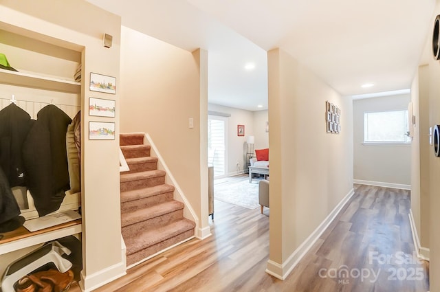 hall with hardwood / wood-style flooring