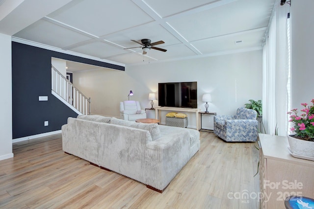 living room with ceiling fan, coffered ceiling, and light wood-type flooring