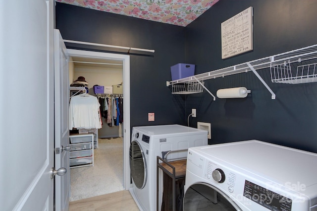 washroom featuring light carpet and washing machine and clothes dryer